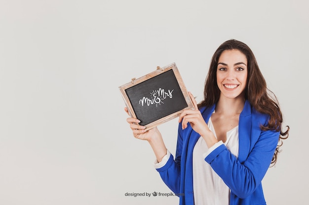 Mockup design of smiling woman with slate