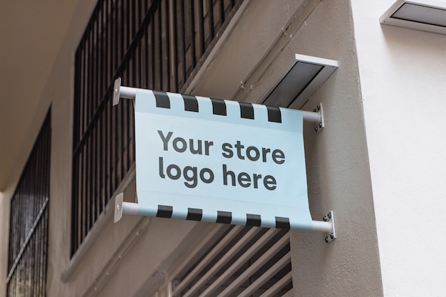 Free PSD mockup sign outside shop 