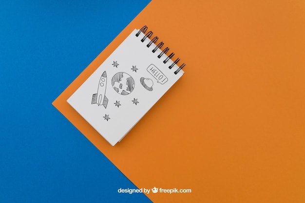 Free PSD notepad on blue and orange background