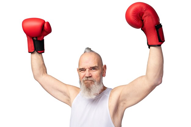 Portrait of senior man with boxing gloves