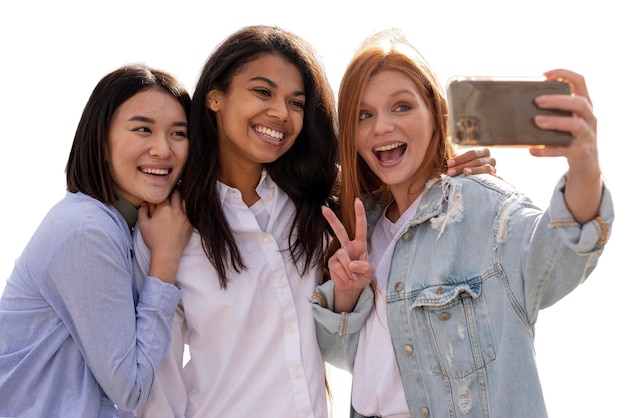 Portrait of young teenage girls taking selfie