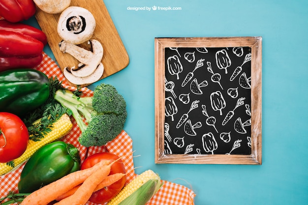 Free PSD slate mockup with vegetarian food