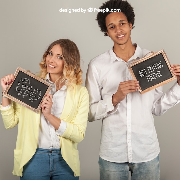 Free PSD smiling couple holding slates