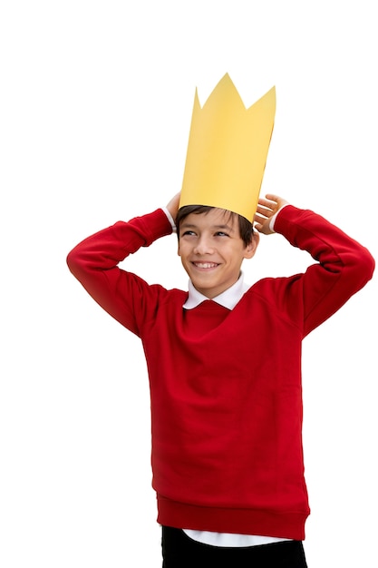 Free PSD studio portrait of young boy with paper crown