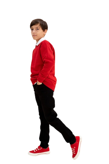 Studio portrait of young boy with red sweater