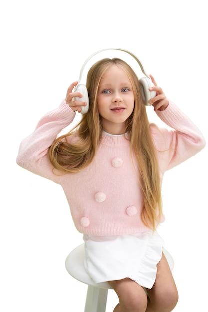 Studio portrait of young girl with headphones