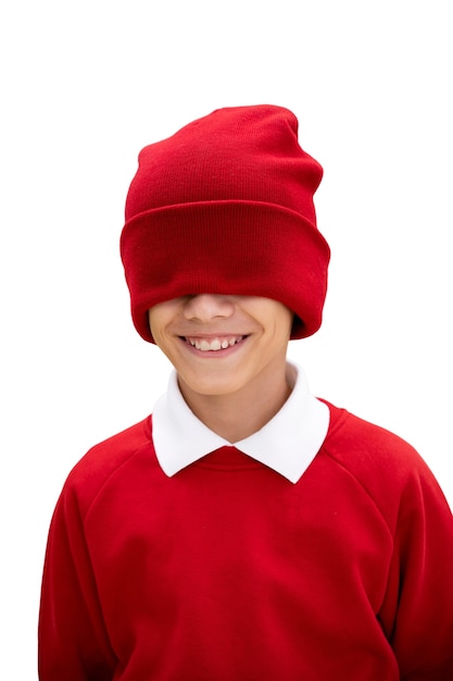 Studio portrait of young girl with red beanie