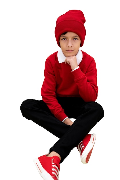 Studio portrait of young girl with red beanie