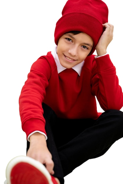 Studio portrait of young girl with red beanie