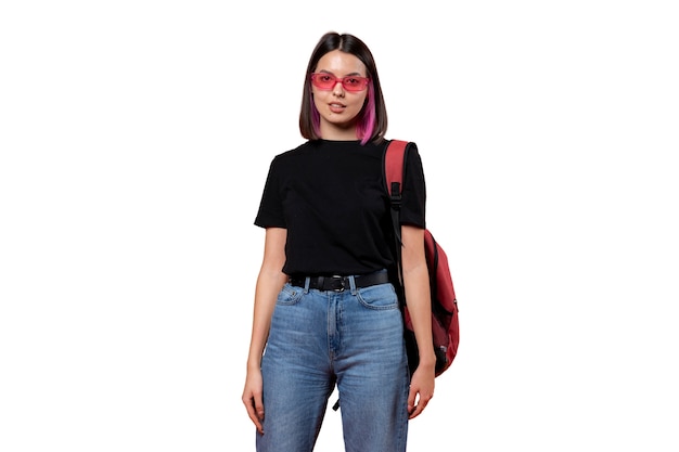 Studio portrait of young teenage girl with bucket hat and sunglasses