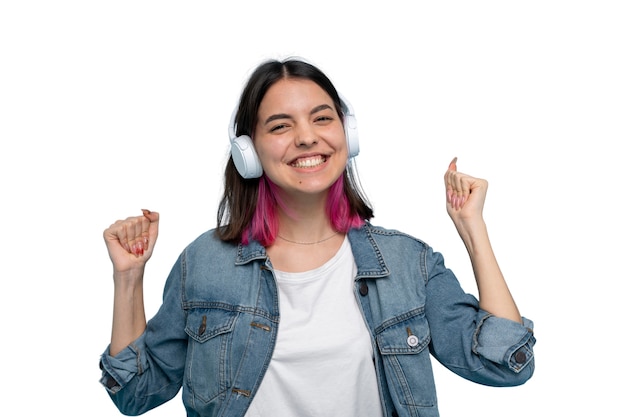 Studio portrait of young teenage girl with headphones