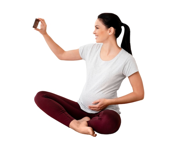 Free PSD view of pregnant woman doing sports