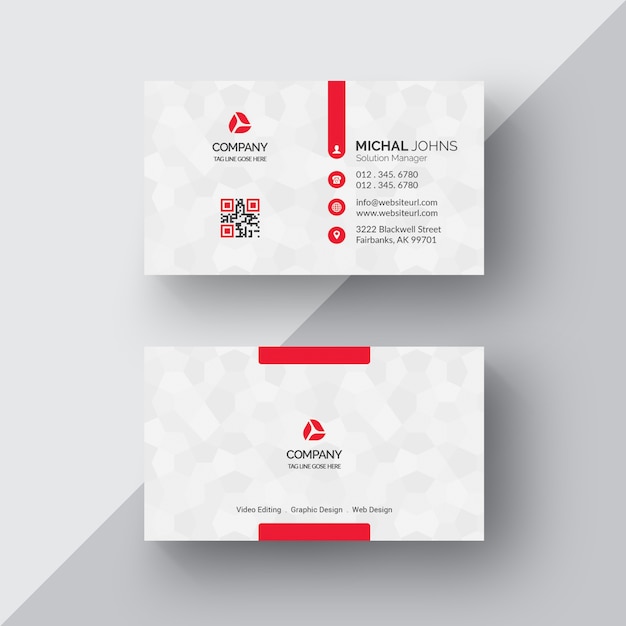 White business card with red details