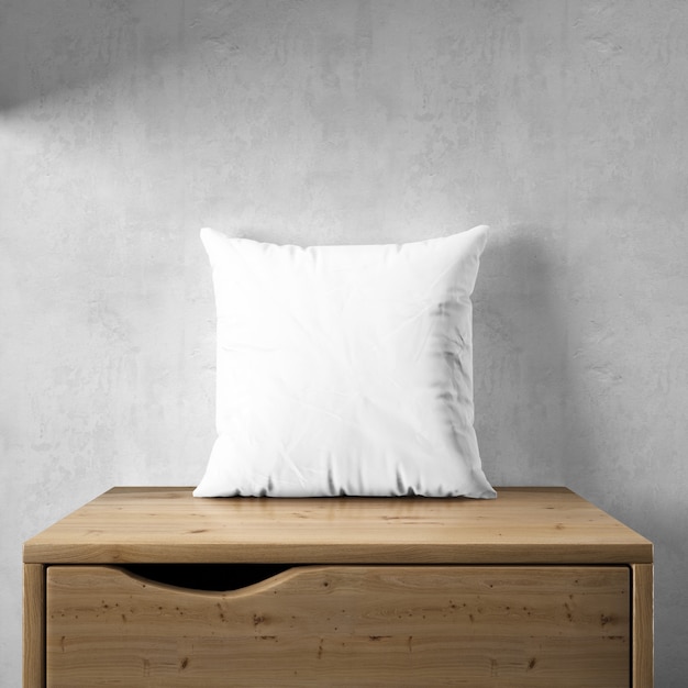 Free PSD white pillowcase mockup on a wooden furniture