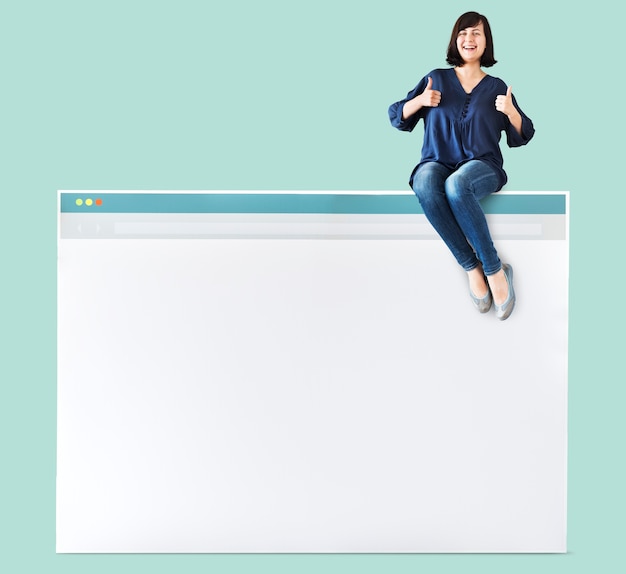 Free PSD woman sitting on top of an internet browser