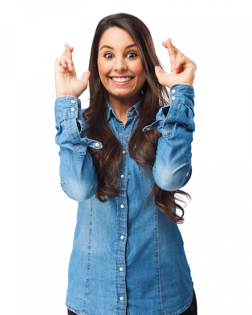 Woman with crossed fingers