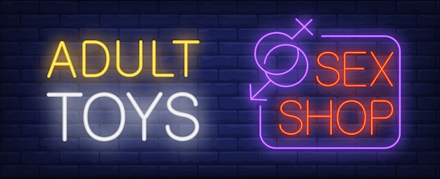 Adult toys in sex shop neon sign. Gender symbols joining in corner of signboard.