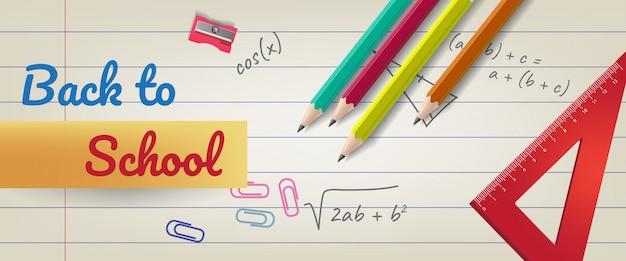 Back to school lettering on lined paper with pencils and ruler