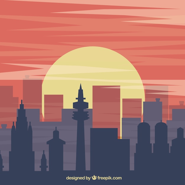 Free Vector background with building silhouettes at sunset