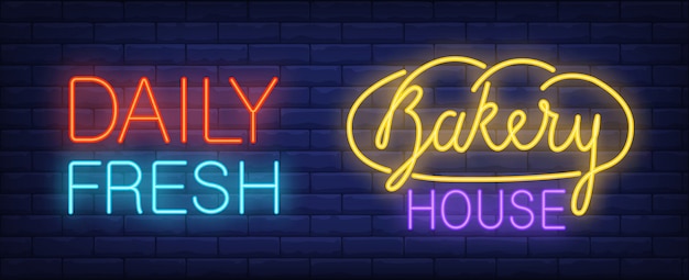 Bakery house neon sign. Loaf of bread and inscription on brick wall background. 