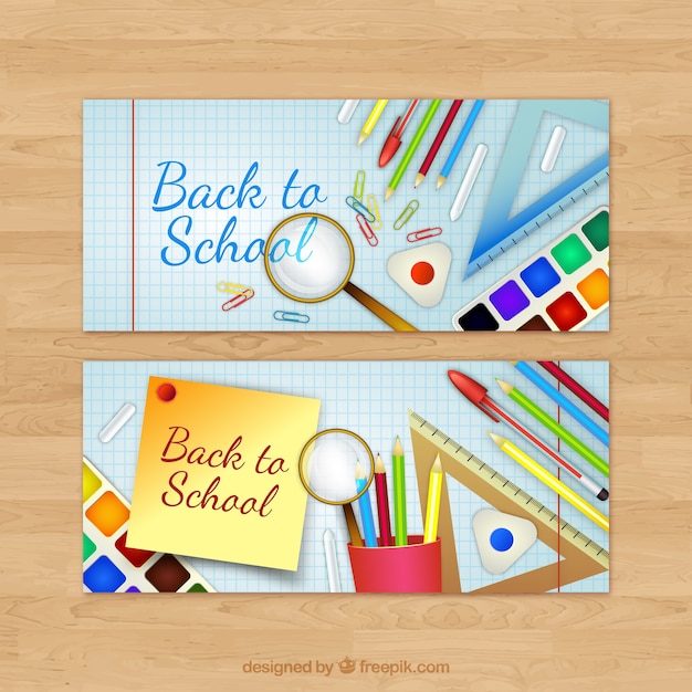 Free vector banners with school material on notebook paper