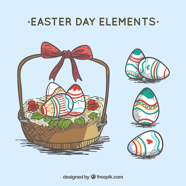 Free Vector basket and hand drawn easter eggs