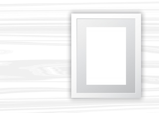 Blank frame on white wood background 