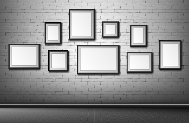 Blank frames on grey brick wall