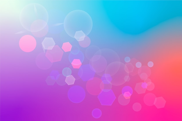 Free Vector blue and pink gradient background with bokeh effect