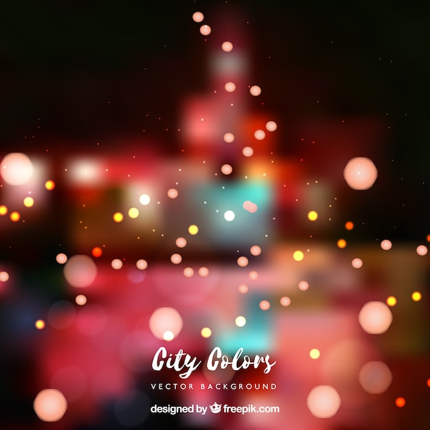 Free Vector blurred city background with bokeh effect