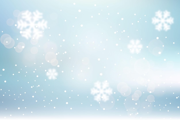 Free vector blurred winter background with snowflakes