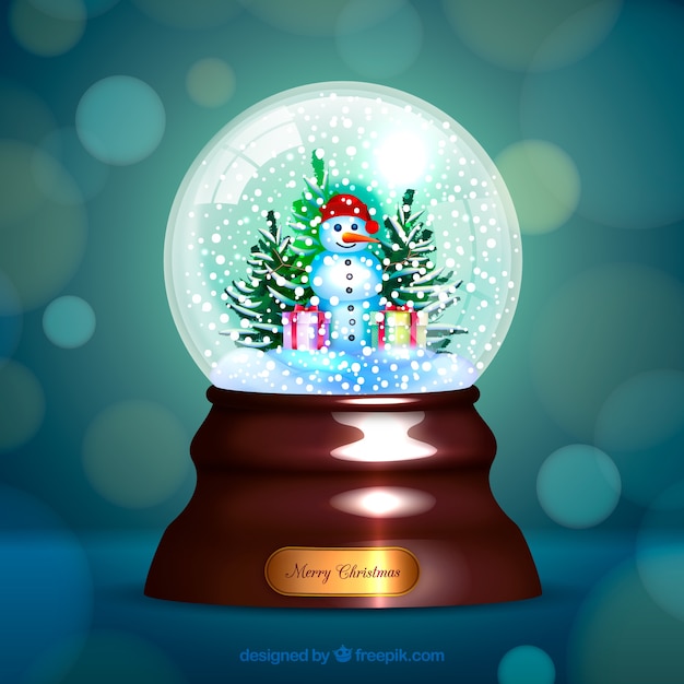 Free Vector bokeh background of christmas snowglobe 