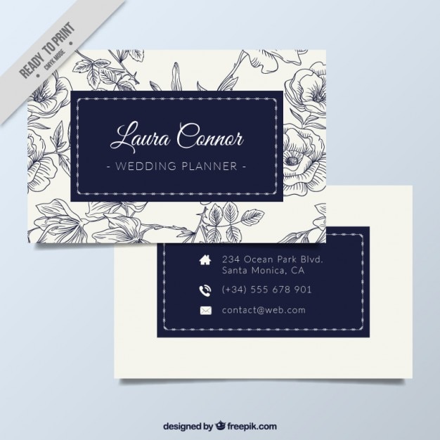 Business card with blue floral ornaments