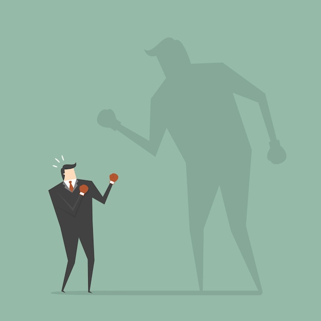 Free Vector businessman boxing with a shadow