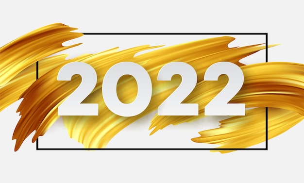 Calendar header 2022 number on abstract golden color paint brush strokes. Happy new year 2022 yellow background.