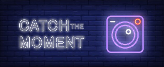 Catch the moment illustration in neon style. Text and camera on brick wall background.