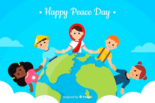 Children holding hands around the word peace day background