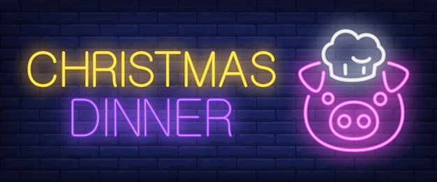 Christmas dinner neon text with pig in cap