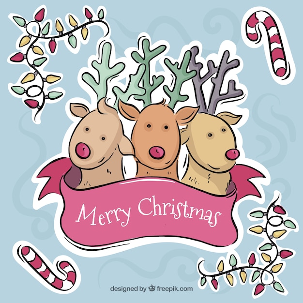 Free Vector christmas greeting with beautiful reindeer and hand-drawn ornaments