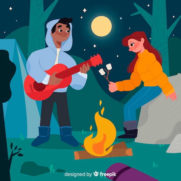 Couple playing the guitar on a full moon night