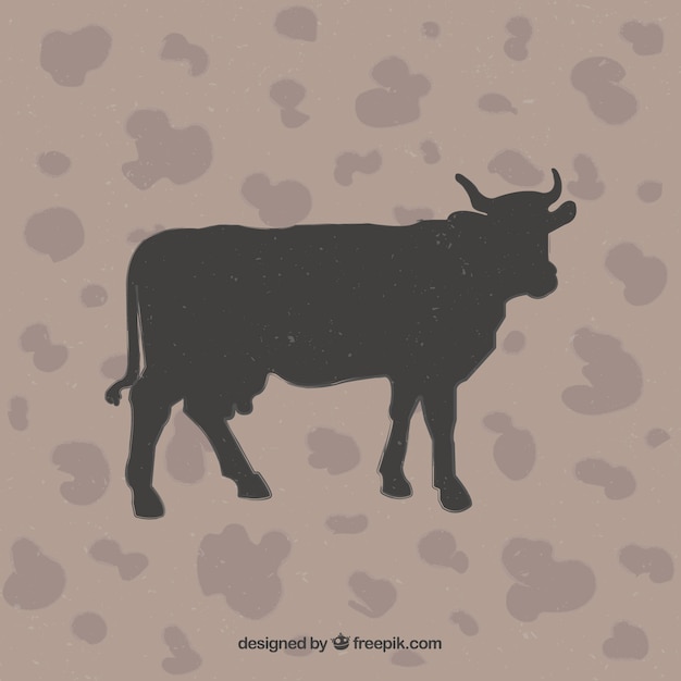 Free Vector cow silhouette on animal print background