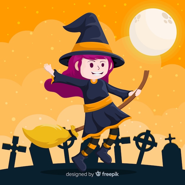 Cute halloween witch in cemetery