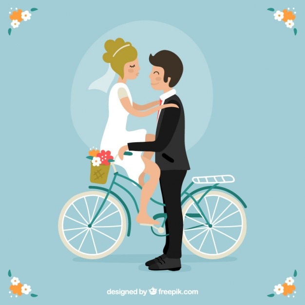 Cute wedding couple on a bike