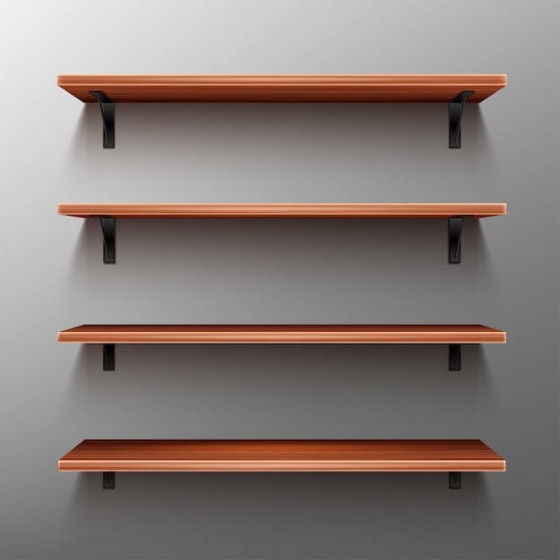 Empty wooden shelves on gray wall