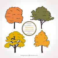 Free vector four cute trees hand drawn