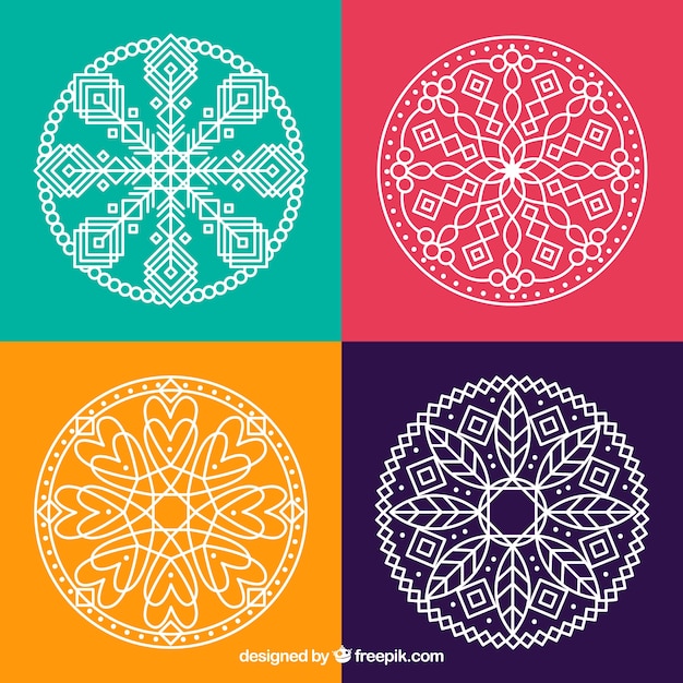 Free Vector four hand drawn mandalas 