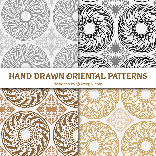 Free Vector four hand drawn oriental patterns