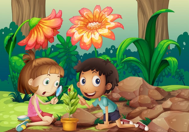 A girl and a boy looking at the plant with a magnifying glass