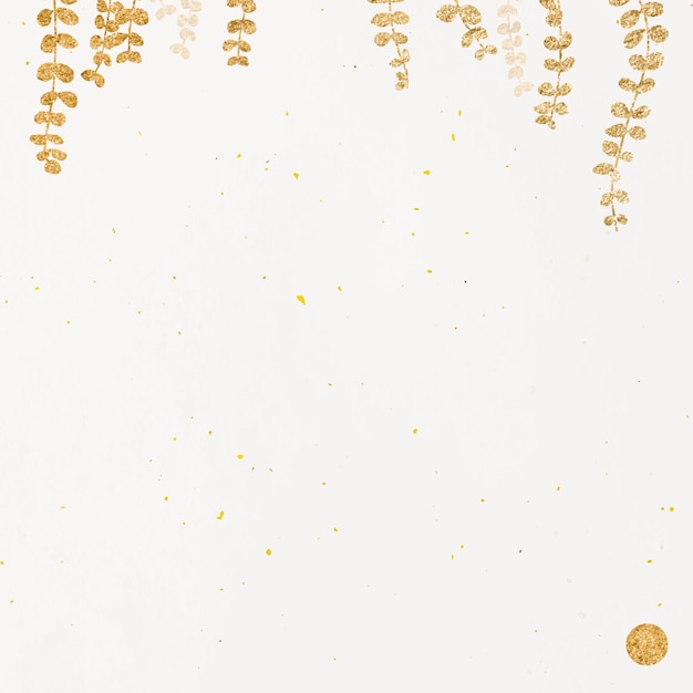 Glittery gold eucalyptus leaf on beige background