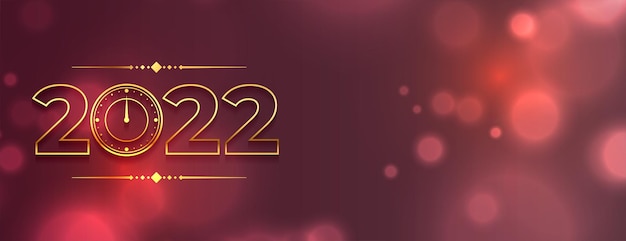 Free Vector golden 2022 text with bokeh background